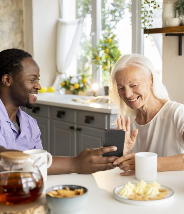 african-social-worker-helping-senior-woman