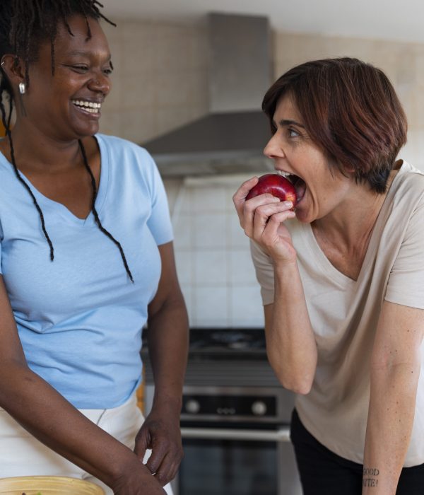 medium-shot-lesbian-couple-home-with-food