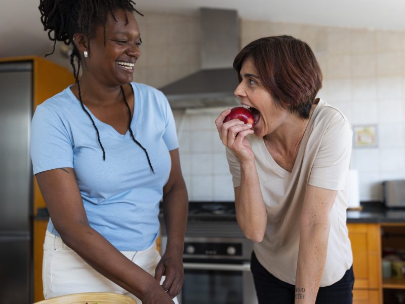 medium-shot-lesbian-couple-home-with-food