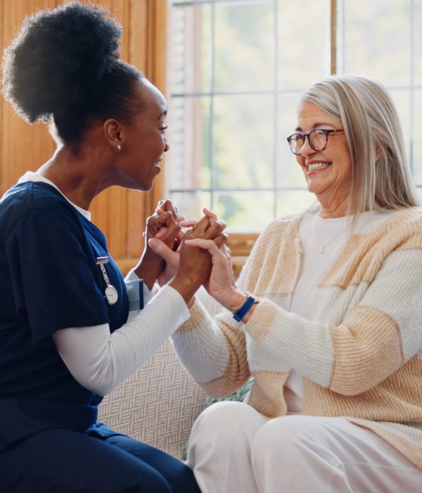 Senior patient, funny or happy caregiver talking for healthcare support at nursing home clinic. Smile, women laughing or nurse speaking of joke to a mature person or woman in a friendly conversation.